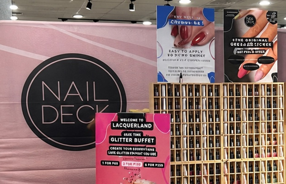 Detail view of the Nail Deck printed backdrop in the event space